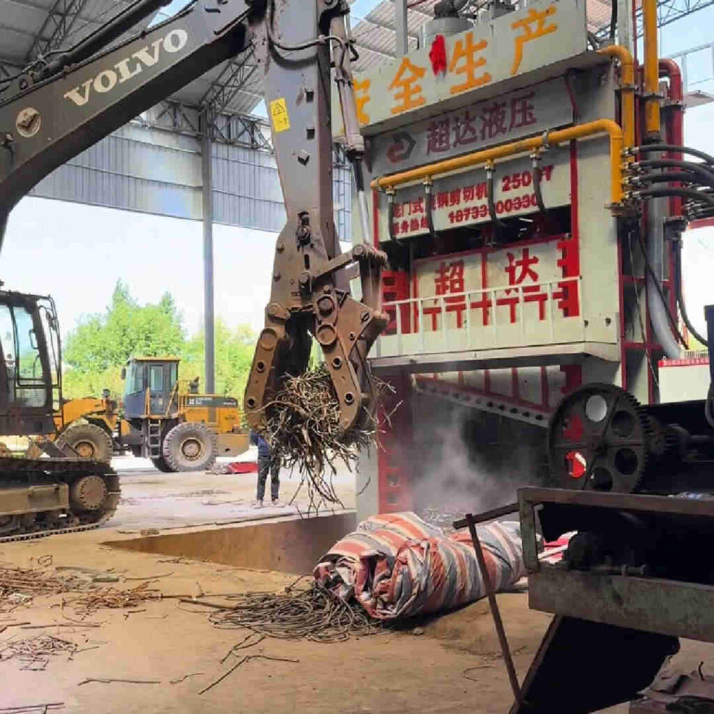 2000T scrap metal shear cutting 300-350 tons of steel rebar per day at recycling facility